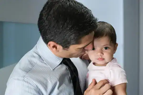Our Values -Father Man holding a young girl, providing family law support and guidance.